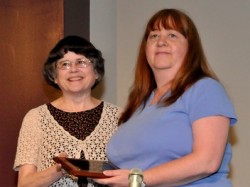 Georgianne Bordner (right) receiving ACL’s Volunteer of the Year Award