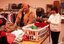 Ellen Cox and Sandra Yaegle sorting clothes